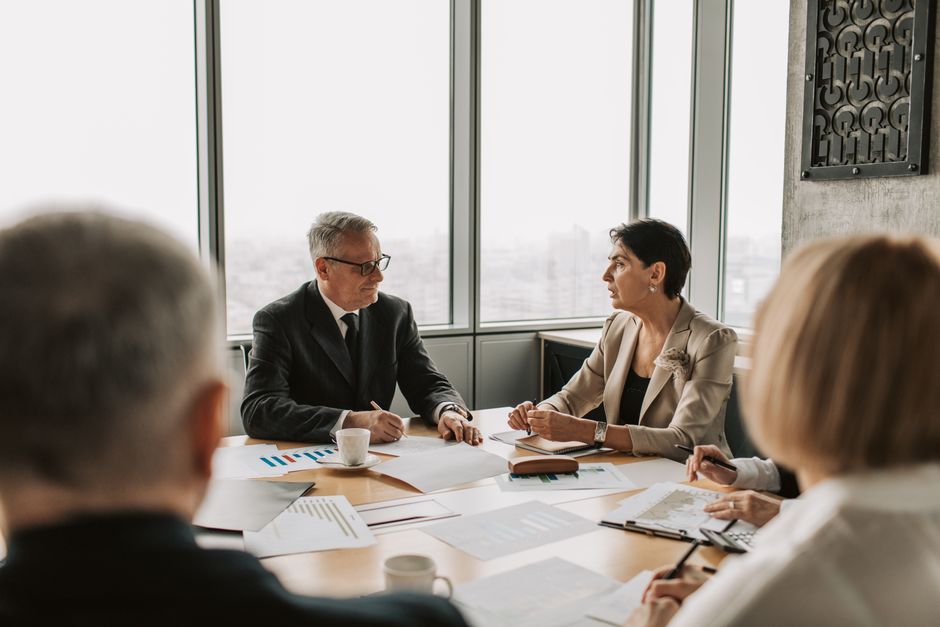 Business professionals in a strategic meeting in a modern office setting
