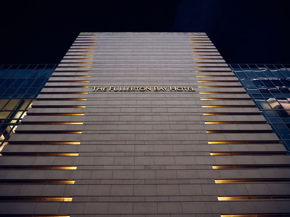 Night view of Fullerton Bay Hotel facade