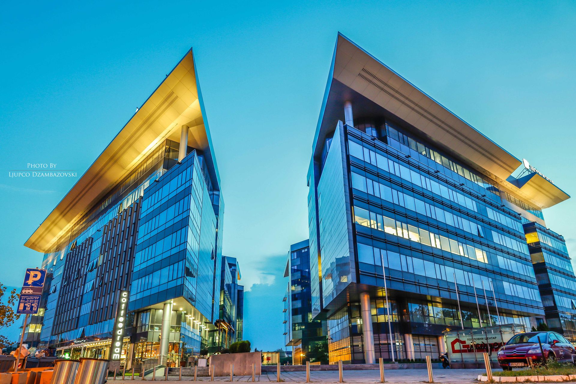 Futuristic glass office buildings at sunset in an urban area