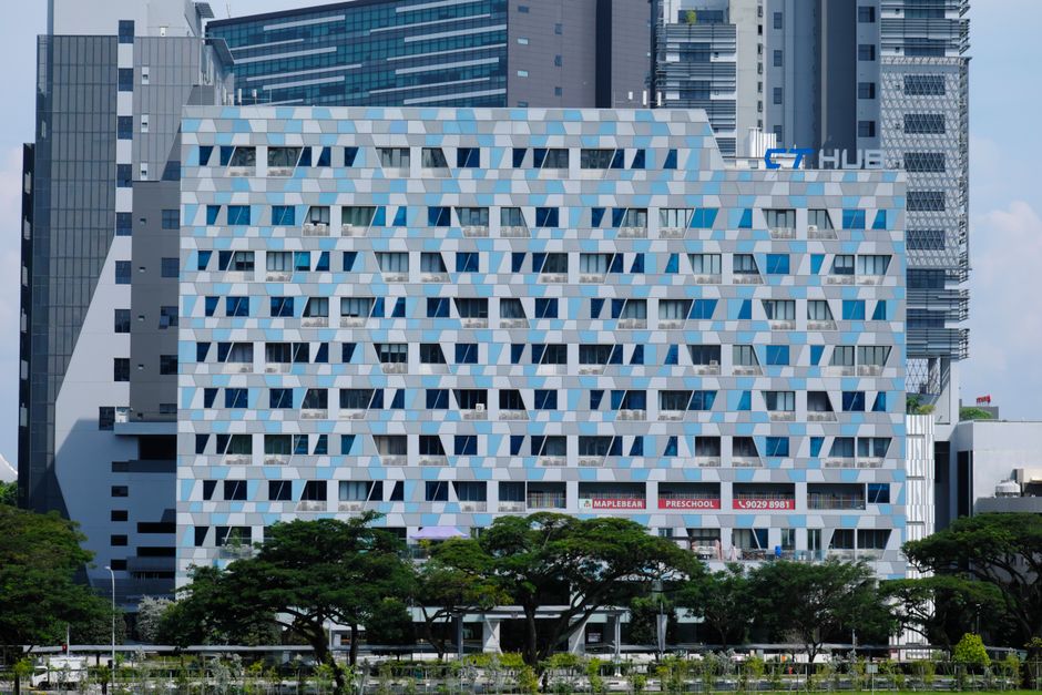 Contemporary high-rise building with a geometric facade