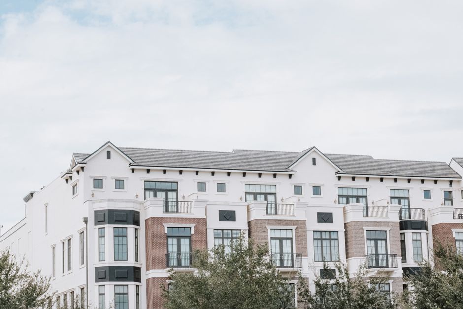 Multi-story luxury apartment building with a contemporary facade
