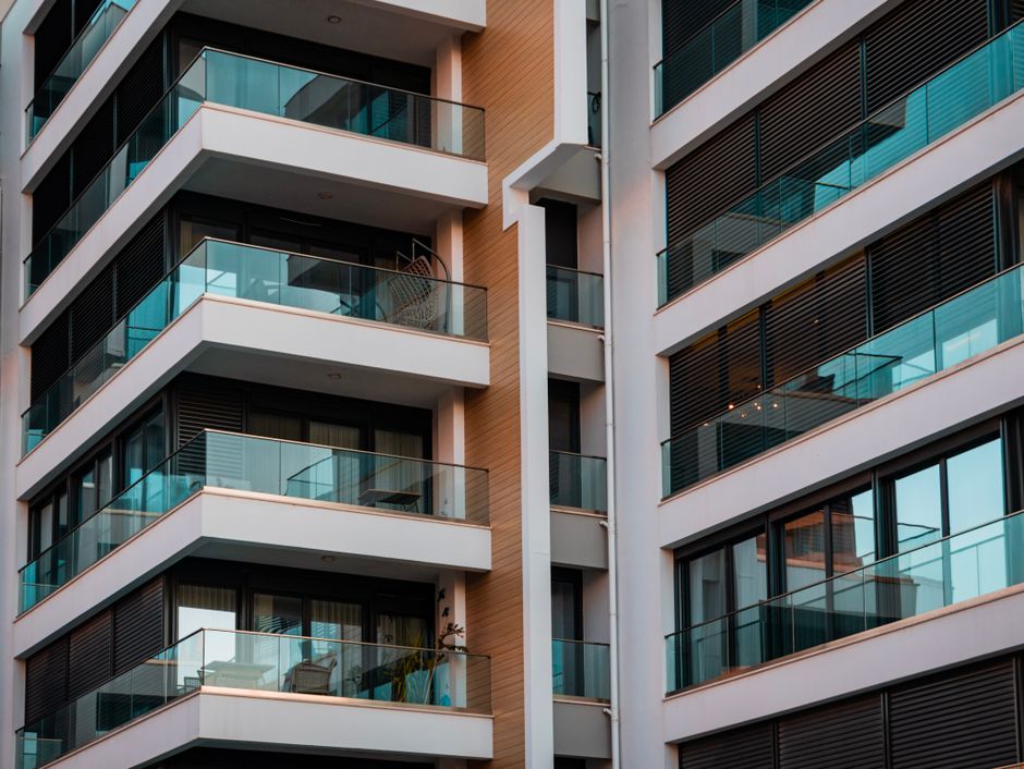 Contemporary residential building with glass balconies and sleek design